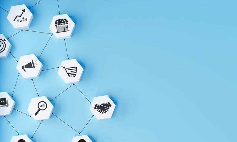 Business and marketing concepts like Ecommerce, advertising, data analysis, and partnership in an integrated digital ecosystem. A network of interconnected hexagonal icons on a light blue background